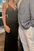 I got so many compliments when I wore it to a wedding! Thick material with full lining. The back is gorgeous!! I fluctuate between a S & and XS and I ended up with the XS. It was a little snug in my hips/thigh area but the material has a nice stretch to it! Will definitely wear again. It's a little long - I'm 5'6 and it worked with heels. - Mary B.