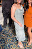 I bought this dress for a wedding and received so many compliments. It's *very* figure flattering. If you don't have much of a waist, the cut of this dress will make it look like you do. Ignore the reviews about the dress being hard to get on as it now has a zipper! The single strap is adjustable to get the fit just right. And the asymmetrical skirt was just the right length on both sides. I tend to run hot and this dress was breathable and light. Seriously I love this dress. - Alex N.