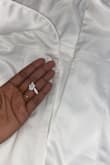 Difficulty with the zipper - after it was zipped up, it split open. Struggled for 15 minutes trying to get the piece unzipped to step out of dress, and ultimately had to rip it open to undress. Now the dress is unwearable. - Krys F.