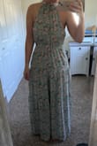 I was hesitant on what size to order because of other reviews. Very glad I stuck with my normal medium and didn't size up to a large. This fits like any other maxi dress would and has a stretchy waistband. For reference I wear size 8 in jeans and normally small/medium in tops. I love the Sage green and pink mix and plan to wear to bridal showers and rehearsal dinners. - Shelby Y.
