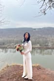 I wore this dress for our Winter Wedding day and it was perfect! Classy with the right amount of =	 with the front slit and low lace back. - Maia P.