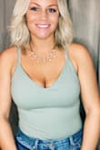 I have a long torso and this is the best bodysuit ever! You could go braless but I didnt. Thick swimsuit type material but not see thru at all. I need it in every color. Best bodysuit! - Lindsay B.