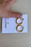 These are a really nice gold color. For some reason they were a lot larger than I expected, maybe I didn't look closely enough. They are also surprisingly light, but that's probably good for your earlobes. I will be returning for a smaller pair. - Jessica C.