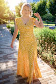 I've always wanted a long, yellow dress that's flowy and fun to wear. This one checks all the boxes. I am a curvy, short chick (not a rail like the model - but that's why she's a model). I was able to wear this without a bra - it has an open back. The front held the girls in, and mostly up - with occasional adjustments. At 5'3, I definitely had to have it shortened. It puddled on the floor before I did, and that was with heels on. It was a touch tight across the top (to be expected with my chest size) and hip (also to be expected because of my hip size), but if I'd gone up a size, it would have been too big all the way around. I was able to move in it easily, not restricting anywhere, and it was so garden-party chic that I was turning heads at the restaurant for my birthday. It's just a fun, chiffon-flowy dress to wear, and you feel stunning. Multiple compliments from strangers. Thanks for making me feel beautiful at 37, Lulus! - Caroline M.