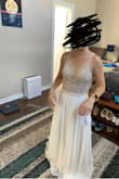 This dress is even more beautiful in person than in photos! The pearly bodice is amazing. Very comfortable, and forgiving in the midsection if you want to plan to enjoy plenty of your own wedding food. It is quite long and I am only 5'0" so I plan to have it hemmed. I am waiting for this dress to come back in stock so I can try a size zero and see which fits better. The size 2 will work fine, but it falls a bit low on my chest and there is extra fabric at the back of my torso. - Kacy S.