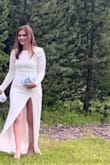 The fit is perfect. The slit is pretty high but I was okay with it. The dress doesn't hide flaws well and even with no show panties you could see them. - Krysee M.
