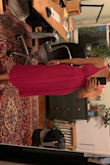 This dress was so fun for a summer wedding! The pink color was really fabulous and got lots of compliments. The small fit great and was very flattering. My one complaint is that the straps, while adjustable, did not stay put so I had to keep tightening them throughout the night. - Lorena M.