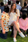 I wore this to our wedding rehearsal and it was very cute! It's made of light material, so it's perfect for a warmer spring day. The top was a little tight but it still fits well (probably ok that it was a bit on the tighter side to stay in place). I'm on the shorter side so clothing is normally a bit long on me, but this dress was the perfect length. The only complaint I have was the sleeves would sometimes fall off my shoulders if I moved too much, even though I have broad shoulders. - Waverly T.