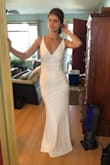 This was my friend's favorite of the dresses I tried on! It was a thick material but was still a bit see-through for underwear lines. If you wear Spanx or a slip this would not be an issue. Very flattering. - Caroline D.