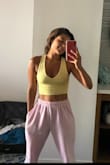 I love this bright yellow top! It is so colorful and comfortable to wear. You will have to wear a bra with this.. I prefer to have tanks where you don't but the material isn't thick enough for that type of wear. I like that it is cropped but not too much. - Alicea K.