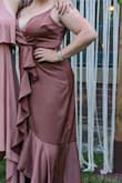 I loved the style of this dress when I first saw it but worried about the fit. I ordered an XL and it was perfect! The satin material is of great quality and the ruffled detail elevated the style. As I am busty, I used body tape to prevent bra straps from showing and fashion tape to close and secure the bust of the dress as it was a bit open. Otherwise, it was the ideal wedding guest dress. - Cristin G.