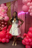 Love this dress, wore it for my bridal shower. I went with a medium because it has no stretch and I wanted it longer but I ended up having to take it in on the sides a bit. - Brittany A.