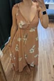 Once I figured out how to tie a wrap dress after a quick google search, the dress overall fit me pretty well. The problem is the bust. I'm not even THAT big on top, only 34D, but if you're this size or larger, I would skip this dress. I really liked it so I took it to be hemmed which is an inexpensive, quick fix. What I didn't anticipate was the saga on top. Once I realized that I couldn't wear a bra with this, I asked a seamstress to also sew non-padded cups in for a *little* support & structure. I guess chicken cutlets or those new boombas could also work. But either way, I still felt so exposed with far too much cleavage so then I had her add two hooks to the front to pull it together. I'm a little worried about dancing in this, hoping it doesn't pop open. But I've come this far with altering it so I'm going to wear it! I'll bring a little jacket with me in case something pops and hope for the best. Basically, if you're smaller on top, go for it! If not, look for something else and avoid the hassle. - Jennifer C.