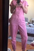 As someone who has historically feared jumpsuits because of the way they generally lay on my body, I am absolutely enamored with this jumpsuit. It is so adorable and fits so well. It is extremely well constructed and I feel not only secure in it, but also a little sexy - just the right amount! The color is so sassy and I believe will really go well with any skin tone. I appreciate the ability to tighten and loosen the waist, and that there is a panel of snaps inside the front, so if you pop a button, you're still covered. The fabric is lightweight but also tough seeming. I can tell that I am going to get years of wear out of this. My best friend bought one, too and we plan on twinning to an upcoming event. Thanks for the amazing outfit! - Jacinta H.
