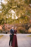 I wore this dress for my engagement photos, I loved the rich burgundy color. The dress didn't fit my body perfectly as I did not fill out the bust fully and with a deep plunging neckline I was concerned with revealing more than I would have liked. I used Hollywood tape to keep the dress in place which did work well for the short duration of the photo shoot. Overall, lovely dress. - Miranda D.