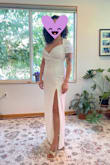 This fits well! I like that this dress feels sexy yet is appropriate for a mom. The neckline is flattering while the midsection is not too tight. The material feels of good quality. I will add shapewear when I wear this dress. The slit is great, I love it! The only thing I would change is to have the back neckline not come up so high, it could easily be a v-cut or a scoop. Anyway if you have a big chest and want to show a little leg this dress is fantastic!! - Alexandra P.
