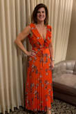 This dress is gorgeous. The color makes it wearable spring through summer and into fall. The orange makes it stand out and the frills on the top give the right amount of design detail without being too frilly. I felt sexy and chic in this dress.
The front was body hugging so I didn't need a bra although I did wear nipple pasties. I also tried the rabbit pasties underneath but the tops showed when you moved but as the top hugged my figure I felt held in and not exposed.
The skirt is pleated and makes it ideal for packing as it did not crease at all. I received lots of compliments. - Susan P.