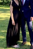 It's a great dress, it fits really well, and I got a lot of compliments on it. It's LONG - I'm 5'10" and wearing flats I was still tripping a little bit. However, the black dress is see-through, and on a windy day be prepared for it to blow open. I purchased a black slip to wear under and that solved both problems. - Leah T.