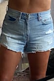 These shorts are adorable. I'm a 29 right now in jeans when I want them to fit loose/comfortably and these in a 29 were snug. They don't have a lot of stretch, but that's what I like about them. They don't wrinkle in the crotch area like a lot of other shorts do and the light wash is perfect. They don't show you butt but they are a good length. Love these. I'd get them in a 30 as well if they had the stock. - Kristine D.