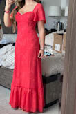 Very nice. Vibrant coral color. Good quality material. True to size. I'm 5'4. In flat feet it falls exactly to the ground. Lulus app and website won't upload my pic so unfortunately I can't show you. - Megan P.