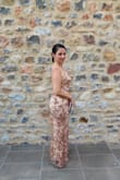 I bought this dress for a wedding in Spain and it did not disappoint. It fit perfectly and I got a ton of compliments on it! It was more breathable than I anticipated, which was a big plus. The layers are thick enough that it isn't see-through at all, but it also isn't too hot. I survived 80-degree weather in this and didn't melt haha. Such a beautiful dress!! - Kelly D.