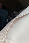 I have this jacket in taupe and navy blue. They are lightweight and nice for work, especially in the summer when it's disgustingly hot out but you want to look professional.

That said, the material is very cheap!!!! My taupe one unraveled and the navy blue is starting to look rough. I even hand washed as per directions. If you want a temporary fix, get the jacket. If you want a quality item, look elsewhere. - Guzal K.