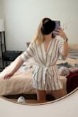 This arrived so wrinkly (see photo) but will be fine after steaming. Love how it's loose and comfy! Material is a bit thin. 

update - unwearable after washing, shrunk so much my butt shows - Katrina B.