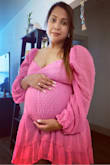 I'm 8 months pregnant and thought xl would be ok turns out it's a bit too big. The tie in the back and my left sleeve keep going down - Pia D.