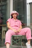 My friends and I love being creative & creating content -- anything from IG, to TikTok to our own personal photography & modeling. So, when I saw this adorable pink utility jumpsuit, I knew I had to get it & create a photoshoot around it. It's such the perfect mix of feminine & masculine & hugs the body in the best ways possible. It's also totally functional -- so whether you're showing it off for a photoshoot like my friend group did, or are using it for something like volunteering, a day shopping, or moving into a new space, it's literally perfect for everything. It has pockets, comfortable material, & is also easy to style. We took a bunch of different photos with different accessories -- high heels vs. sneakers, hat vs. hair up, necklaces & bracelets vs. no jewelry, & more. This was actually personally my first time shopping with Lulus, & because of this high-quality, functional, comfortable, breathable, and stylish product (with amazing on-photo results!) I'll shop here again. Love it - def get it! - Annabelle S.