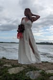 This dress is Hot, Hot, Hot! It makes you look so sexy. It's a great beach wedding dress. It was my first choice for my boho wedding but the moms had some reservations due to being able to see through the skirt part. It has a body suit so you're not naked but it is revealing. I couldn't part with this awesome dress so I packed it, took it on our honeymoon with us to Alaska, and did a photoshoot there. It packs great! It had no noticeable wrinkles and the material is such high quality. The lace is gorgeous! This would be a great location wedding dress too. I'm in LOVE with it and I'm going to find reasons to wear it again and again. I don't care. I am obsessed with the dress. - Nichole P.