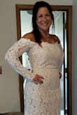 I have some weight I'd like to lose before my wedding, but we haven't even set a date yet! I am SO happy with this purchase. I'm going to have the zipper redone just to ease the stress of it breaking on me. This is a gorgeous dress and the cost is so practical it makes me giddy. My fiance took this picture and I didn't realize it was bunched up, but still gives a good idea. Can't wait to wear it for our wedding!
It won't let me add the whole photo - sorry it's split! - Amy K.