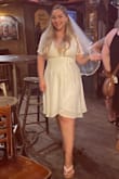 I purchased it for my bachelorette. I wore a sexier outfit and then switched into this after dinner to be more comfortable. The material is of great quality, I think the dress is super cute. The only problem is that it wasn't made to accommodate larger boobs so I had to wear a bralette on top of my bra, otherwise, my bra would have been on full display. No amount of pinning or sewing would have worked because there simply was not enough fabric. I also wish the tie part hit more at my natural waist, it was high. All in all, very cute dress. - Megan J.