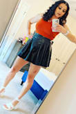 I really like this crop top it's a little longer than most traditional ones. The cutout goes great with my back tattoo because it frames it perfectly! Good material I did not wear a bra with this shirt and didn't feel like anyone could tell! Wore this shirt to a concert then a nightclub after and never had to re-tie the bow in the back! - Kelly W.