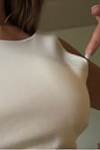 First off, it arrived with the seem not sown together and had to take it to get fixed by my local seamstress. I live in Canada and it doesn't make sense to send any items back after paying shipping and customs. 
It also fits weird at the sides of my chest and will probably take it back again to be altered to even make me want to wear it. - Kirstyn T.