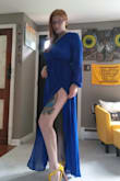 Fits better than I anticipated. Definitely a sexy slit for the leg. Thicker material than what I thought, but it would be good for a fall wedding. a wee bit too warm for the summer. - Angela C.
