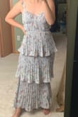 Extra fabric near ribcage isn't bad for smaller busts with correct size. But the length is a no-go for people under 5'5. I felt like a Christmas tree. You'll either have to get it hemmed or remove the bottom layer like I did. - Kaoshoua T.