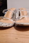 The heels were SO cute but one of the shoes seems to be dented/have a defect, it is raised upwards. Hopefully, it goes away with walking on the shoes and flattening it... Final sale so I can't return. - Andrea H.
