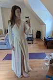 Absolutely gorgeous. The material feels high quality and has some weight to it. I am impressed with the quality of the buttons and loops. I'm wearing this the evening my fiance and I elope and cannot wait ! - Susana K.