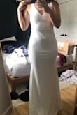 I just couldn't rationalize paying hundreds and even thousands for a dress I was going to wear one night, so I took a chance on this and love it! I would go as far as saying it's my favorite that I have tried on... maybe it's the price, but this is a godsend when you're looking to cut cost for your wedding. Excuse the messy room. - Amanda C.