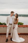 I wore this for my reception dress. Absolutely loved it! I had my tailor add bra cups to it, which made everything super easy. A little hard to get on and off, as there is no zipper or buttons. - Courtney G.