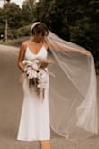 I previously fell in love with an $1800 ballgown dress from a bridal shop but didn't feel like myself in it. I have bought many Lulus dresses in the past and always feel so comfortable in them. I bought this dress to see if I would like it for my wedding and never looked back on the other dress! - Alyssa K.