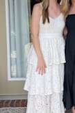 I ordered an XS based on the size guide and it fits perfectly! The material was great too. The lace wasn't itchy at all and laid nicely. I was so excited to wear it and got many compliments on it! I'll be wearing it again soon! - Cammie H.