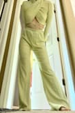 They fit like the picture with the model, a little loose and flowy. You can probably size down if you want a tighter fit, but it is gathered at the waist so maybe not. The fabric is super soft, lightweight, and comfortable with a good amount of stretch. They're obviously a little long on me since I'm so short, but that's not a big deal for me. - Kelsey A.