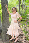 I loved the dress and the color. It fit beautifully. I ordered it for my birthday party. I am a size medium normally and ordered a large as I read it runs small. I'm glad I did that as the Large size fit just fine. I did add an undershirt as the neck runs low. - GLADYS R.