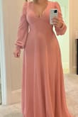 This is a beautiful dress. I ended up sending it back for two reasons. 1. It's way too long. 2. The cleavage area was just a bit too revealing for my comfort level.
Had it not been for the cleavage I would have paid to get it hemmed. If that doesn't bother you then buy! - Linda T.