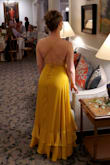 Beautiful dress and a very flattering cut. I am right between XS and S right now, so I ordered the XS and it worked. I think the S probably would have been fine too. I wore it to my friend's July wedding and got told I looked like Belle! ::childhood fantasy - complete!::  The bust runs large, but I figured out a way to hack it. I wore chicken cutlets, used boob tape and a safety pin in front to ensure no gaps, AND I had my partner tie a knot in the highest fabric loop on both the right and left sides in the back, at just the right length, before continuing to lace the rest of the loops below. It worked perfectly! The boob area never got saggy. Also, I used the "steam" setting on a hotel iron to steam the dress while it was hanging up and that worked perfectly to remove wrinkles. Highly recommend this dress! Unfortunately, the photo uploader kept turning my photo sideways no matter if I saved it rotated to compensate. Sorry, the pics are goofy. - Maria P.