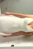 I think this dress really depends on your body shape for sizing.  It fit really nicely everywhere except for my waist and it felt like there was some gaping.  I sized down to a small (which is pictured) and it was perfection.  The quality of their dresses are amazing.  Lesser quality dresses at David's bridal in similar styles run at 300$ or more a dress.  I've returned a few other dresses I tried through Lulus so easily.  I'm so grateful I found Lulus and cannot wait to wear this on my wedding day.  The other dresses I tried were so beautiful I just felt the best in this one!! It is more white than ivory to me but it's stunning.  And so comfortable! And great for bigger cup sizes. - Brittany W.