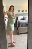 Loved this dress so much I also bought it in black. I bought the dress back in May. I'm now 26 weeks pregnant and it's still comfortable. It's snug in the bust area. I usually need a size XS in all lulus dresses and tops. Due to being pregnant and having a larger chest, I ordered a size medium. Very happy with the material, stretch, and style. - Katie B.