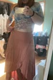 I love the flowiness and color of this skirt, but it's looser than I expected. It fits well if I wear it low over my stomach, but I would need a smaller size to wear it up at my waist like most skirts. - Jocelyn G.