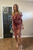 I got this dress for my 40th birthday. I used the tool and ordered a medium when normally I would've ordered a L or XL due to my hips. I am small on top and had I ordered a L it would've been too loose on top. The cinching for the bottom half was flattering and forgiving. The slit does ride up so I pinned it. I absolutely loved this dress. I don't own anything body-con so I was very pleased with the way it fit. - Melissa H.